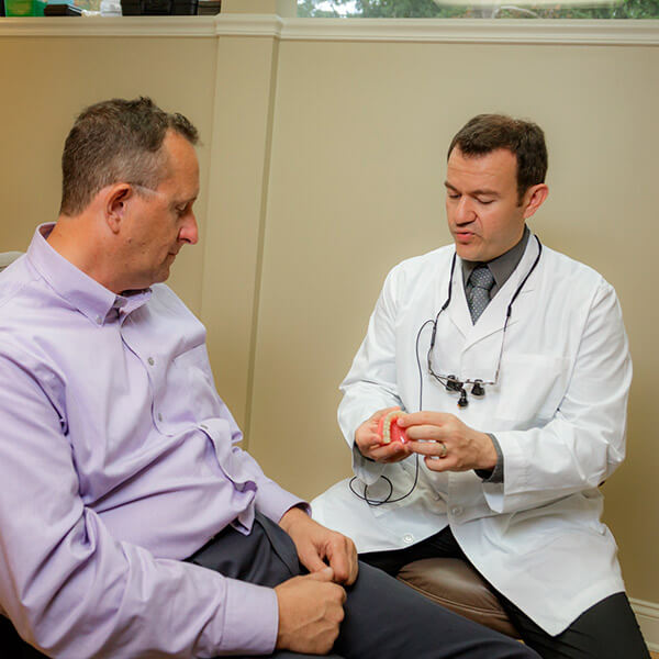Dr. Ardelean explaining the procedure to his patient